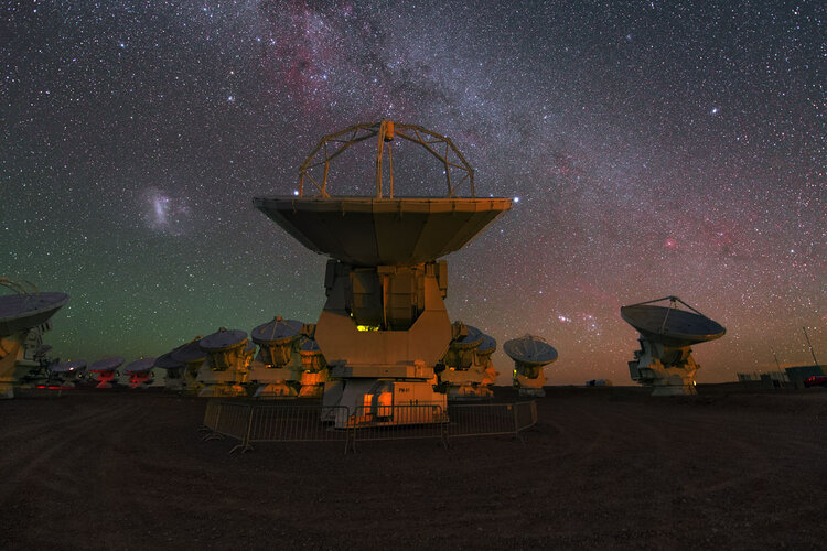 ALMA antennas scan the starry night sky