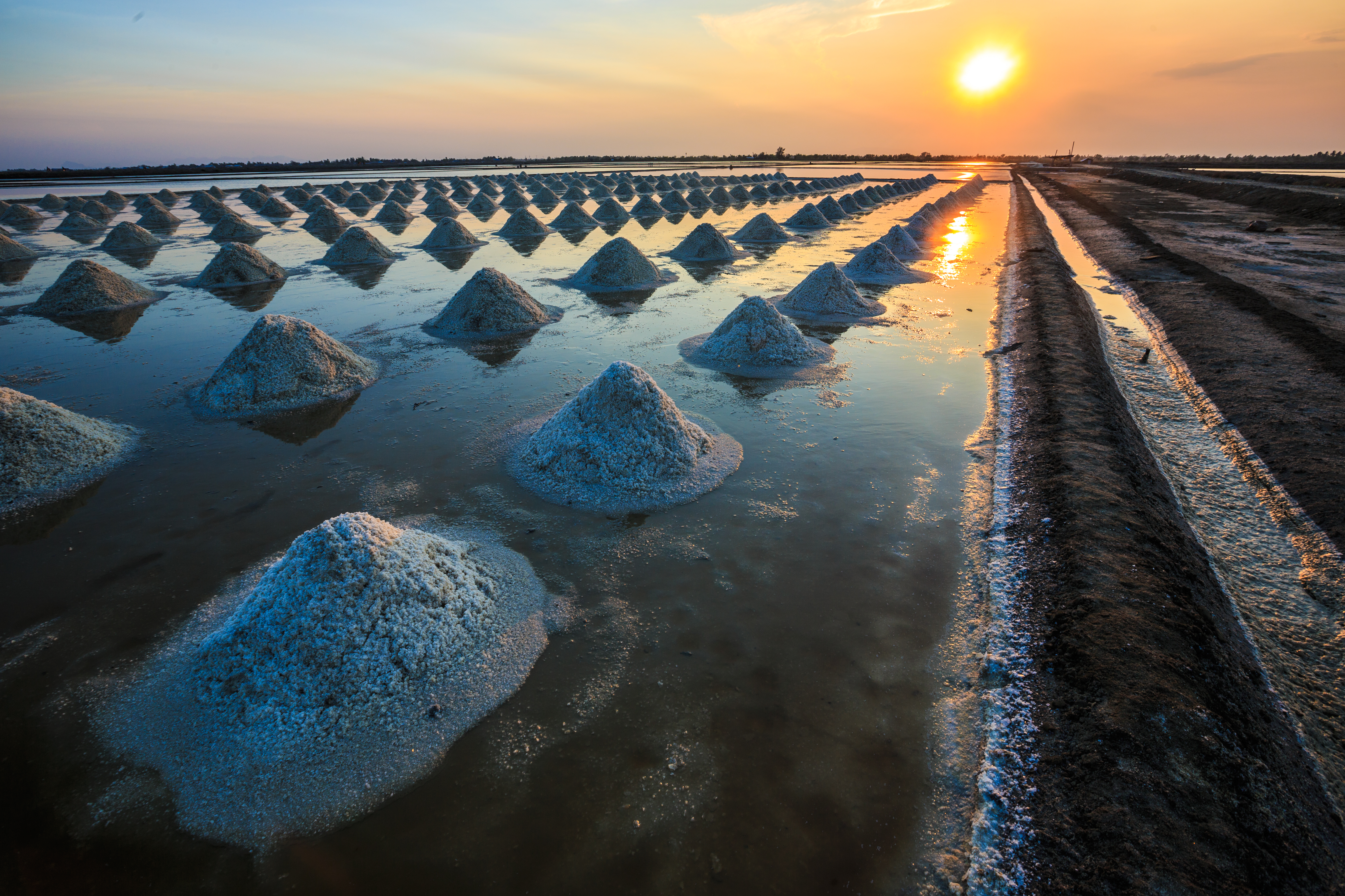 Evaporated salt piles on a beach