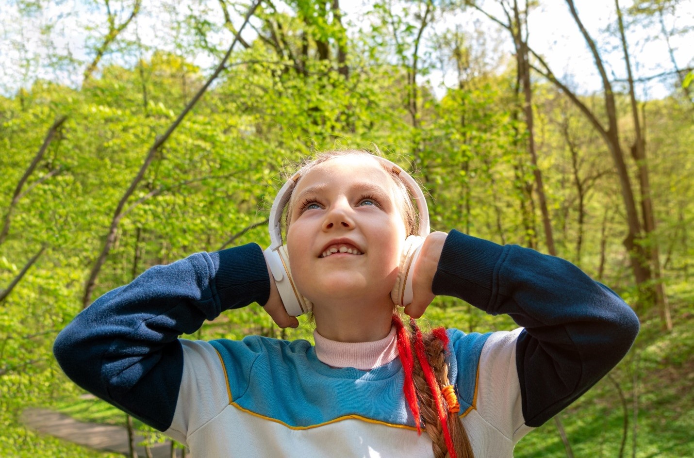 Picture of girl listening to podcast